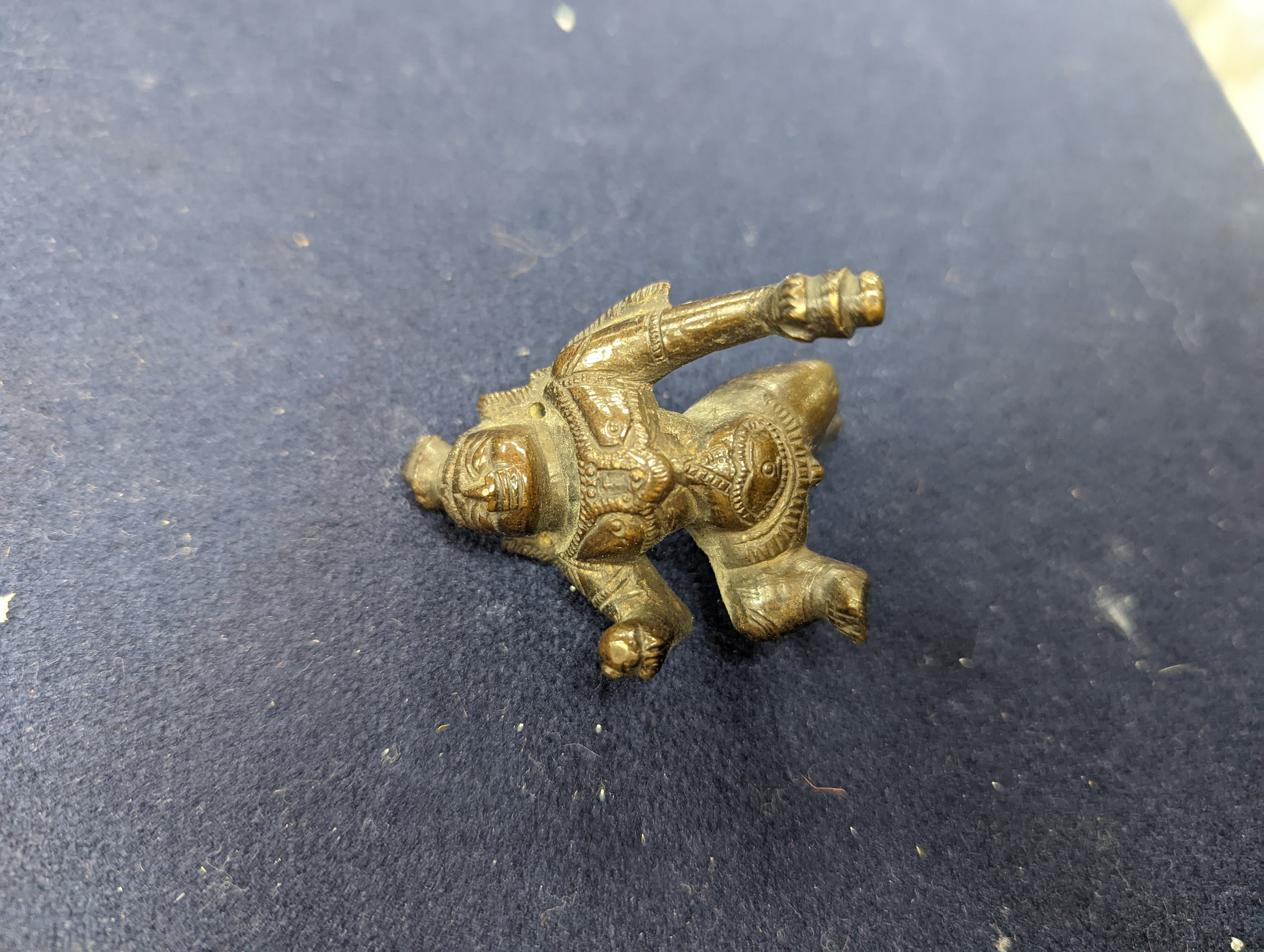 A Chinese gilt copper figure, a Chinese Dog of Fo, a bell, a censer, six Indian bronze figures and a scroll box